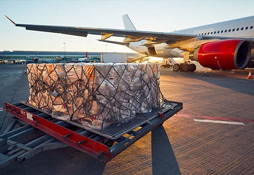 Cargo plane being loaded on the airport tarmac